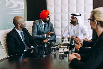Cinematic image of a multiethnic business team working together in Dubai in offices. Concept about...