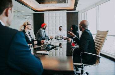 Cinematic image of a multiethnic business team working together in Dubai in offices. Concept about...