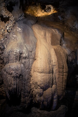 Giant stalagmite in a an underground cave