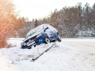 Abandoned car on the side of the road after a traffic accident. Symbolizes hazardous conditions in...