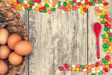 Easter background with eggs and colorful candies with space for text