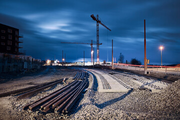 Construction site of railroad track. Building of new tram connection in city.. - obrazy, fototapety, plakaty