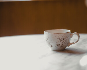 cup of coffee on wooden table