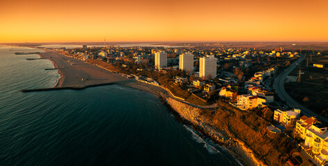 Agigea and Eforie Nord seaside resorts. Aerial view during a beautiful sunrise, Black Sea landmark...