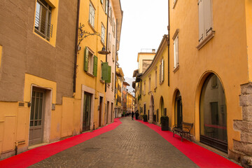 Fototapeta premium A quiet street on Christmas Day in the small town of Arco on the North Garda Plain, Trentino-Alto Adige, Italy 
