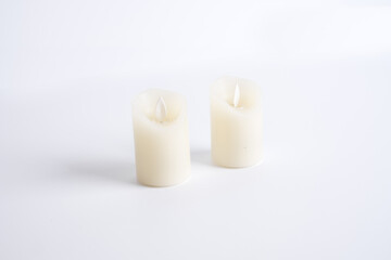 Fototapeta na wymiar Fake blank plastic candle on isolated background