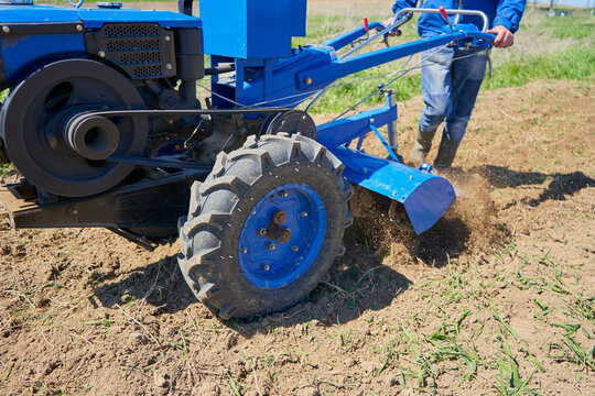 ground cultivation of two wheeled tractor,tillage with a tractor for planting crops