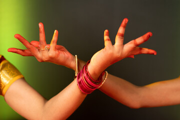 close up shot bharatanatyam dancer hands showing Avahittha hasta form or hand gesture - concept of...