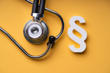 Medical Doctor Malpractice. Paragraph And Stethoscope
