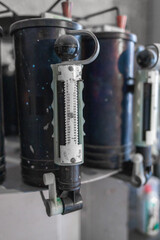 the paint tinting device is installed in the production hall. According to a given scheme, adds colorants to a container for mixing ingredients