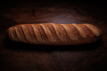 Homemade french bread baguette on wooden backround