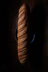 Homemade french bread baguette on wooden backround