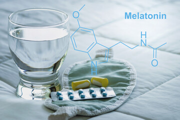 Fototapeta na wymiar Melatonin formula, sleeping pills, earplugs, blindfold.
