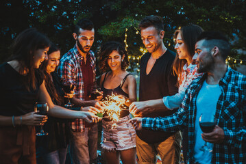 Group of friends eating in the nature