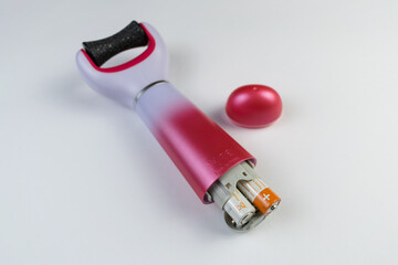 electric callus remover machine white background closeup remove old skin care treatment open , batteries