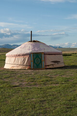 Mongolian traditional house named ger or yurt, in a beautiful landscape. Blue sky.