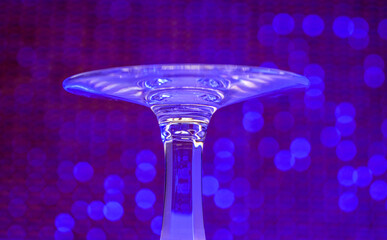 Glass made of crystal-like materials photographed in the studio with colorful background