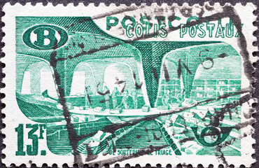 Belgium - circa 1950: a postage stamp from Belgium, showing a Railway Stamp: sorting the parcel