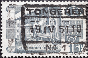 Belgium - circa 1950: a postage stamp from Belgium, showing a Railway Stamp: shipping of the parcel