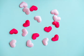Valentine's Day background. White and red hearts on pastel blue background, top view, copy space. Valentines day concept.