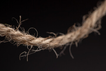 Coil of rope on dark background