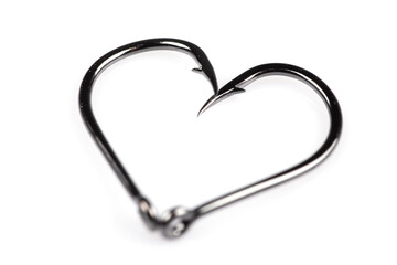 Black fishing hook love heart sign isolated on a white background. Fishing hook close up. Fishing tackle. Stainless steel hooks. Fish hooks in heart shape. The concept of love of fishing.