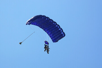 	
Tandem Skydiver in a blue sky	