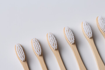 Set of ECO friendly wooden bamboo toothbrushes. Save the planet or NO plastic concept. Isolated on white background.