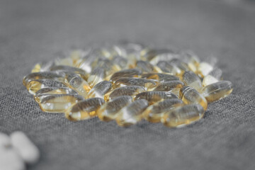 Vitamins and dietary supplements close-up. Macrophoto of capsules. Vitamins on the table.