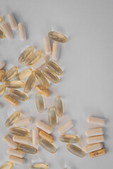 Vitamins and dietary supplements close-up. Macrophoto of capsules. Vitamins on the table.