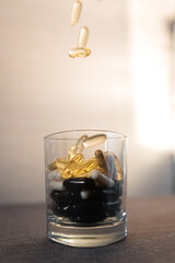 Vitamins and dietary supplements close-up. Macrophoto of capsules. Vitamins on the table.