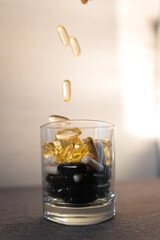 Vitamins and dietary supplements close-up. Macrophoto of capsules. Vitamins on the table.