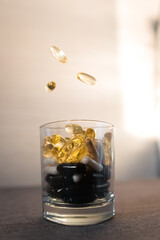 Vitamins and dietary supplements close-up. Macrophoto of capsules. Vitamins on the table.