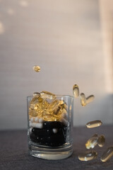 Vitamins and dietary supplements close-up. Macrophoto of capsules. Vitamins on the table.