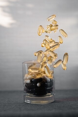 Vitamins and dietary supplements close-up. Macrophoto of capsules. Vitamins on the table.