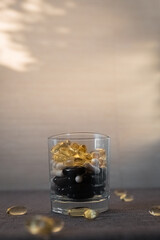 Vitamins and dietary supplements close-up. Macrophoto of capsules. Vitamins on the table.