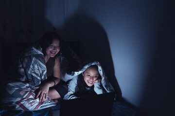 Young women at a sleepover watching very interesting and suspenseful movies.