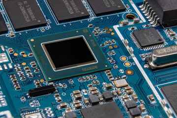 Detail of electronic board of computer. Close-up of electronic circuit board with processor, chipset, microchips and SMD components