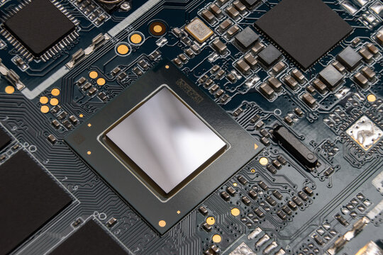 Detail of electronic board of computer. Close-up of electronic circuit board with chipset, microchips and SMD components