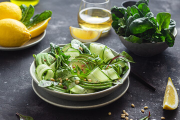 Vegetarian salad with avocado, cucumber and herbs