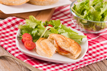 Puff pastry filled with tomato and mozzarella cheese.
