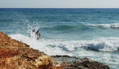 Waves splashing on the mediterranean sea on the island of Crete in Greece. 