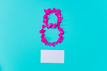 figure 8 of the petals and an empty card for the inscription on a blue background
