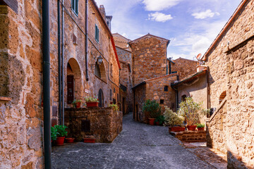 Narrow street with ancient houses in medieval city Sorano