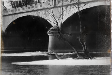 Aged photo effect of the Chenango River running under the Memorial Bridge at Confluence Park in...