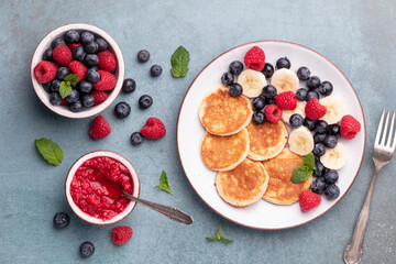 Fototapeta na wymiar Keto diet pancakes made or almond flour, served with berries.