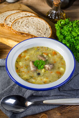 Polish barley soup with vegetables and chicken heart.