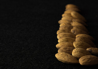 almonds on black background 
