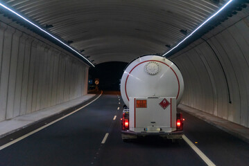 Tanker truck with dangerous goods, flammable gases, circulating inside a tunnel