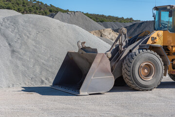 Excavator shovel moving sand in a quarry. © M. Perfectti